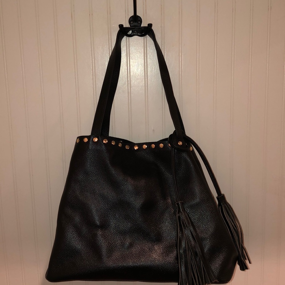 LAGGO shoulder studded tote with tassels.